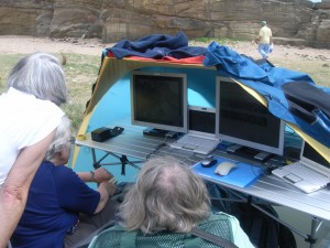 Tutor and students at the ERA base location viewing the video feed and communicating via VoIP with the field geologist. Howick, Friday 07 August 2009